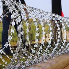 A roll of razor wire on top of a fence in Juba, South Sudan.
