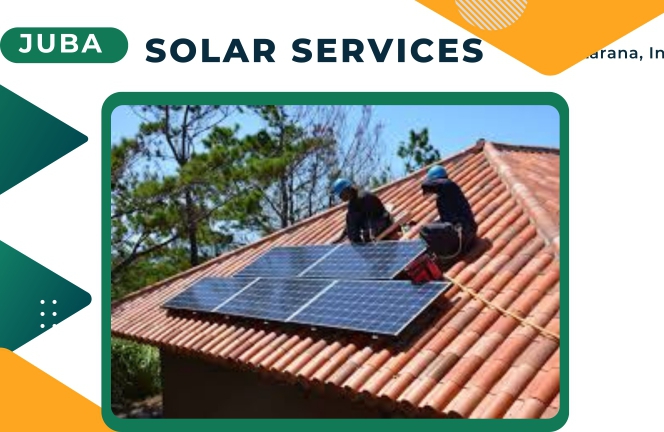 Two solar technicians on the roof fixing solar panels in Juba South Sudan