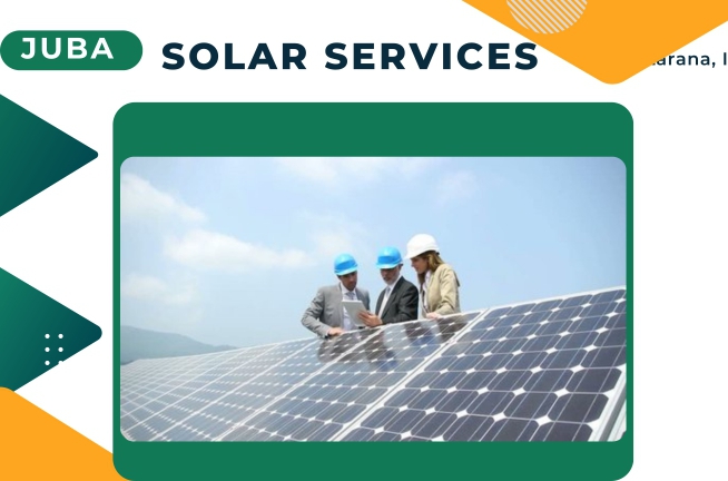 Three technicians on the roof besides solar panels in Juba South Sudan
