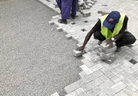 Technicians installing pavers in Juba, South Sudan