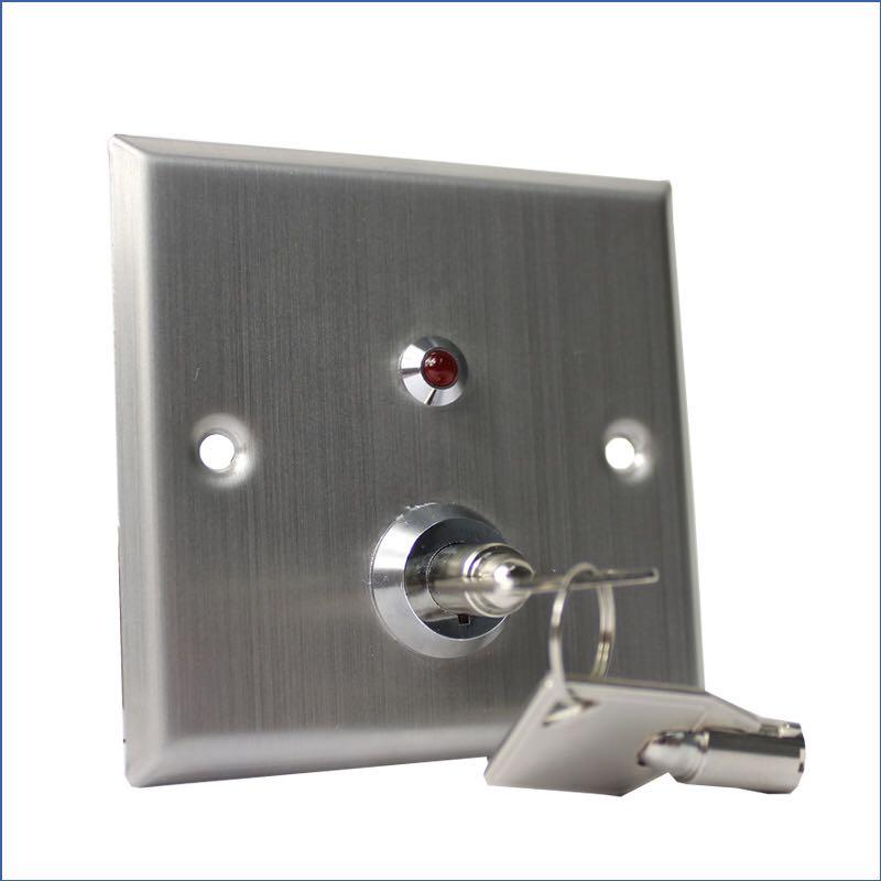 A silver key switch and key in it