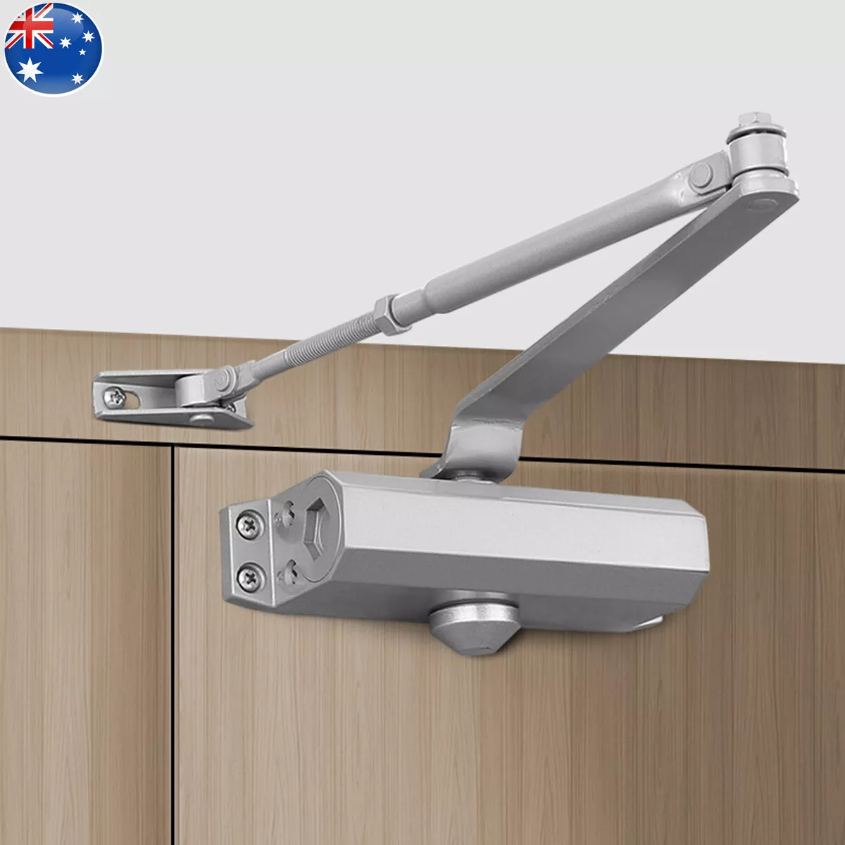A silver door closure mounted on a door