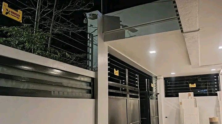 Electric fence installed on top of wall fence and gate