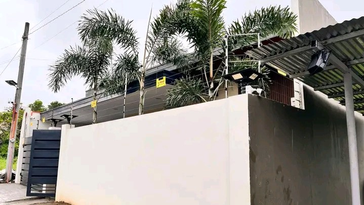 Electric fence on top of a wall fence