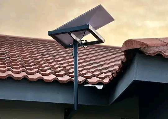A Starlink Wi-Fi extending high to the sky with a metal rob on the roofing in Juba, South Sudan